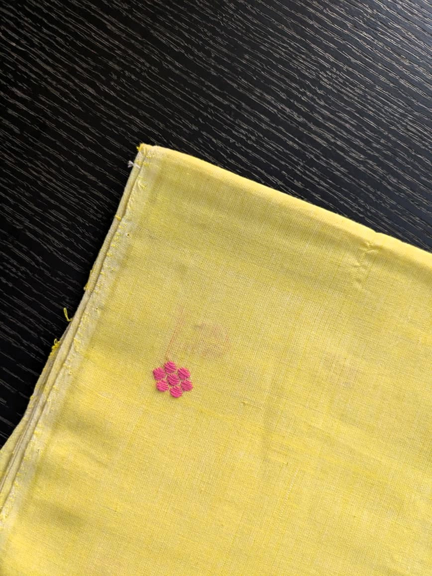 Running Fabric- Yellow Mercerised cotton with Pink motifs